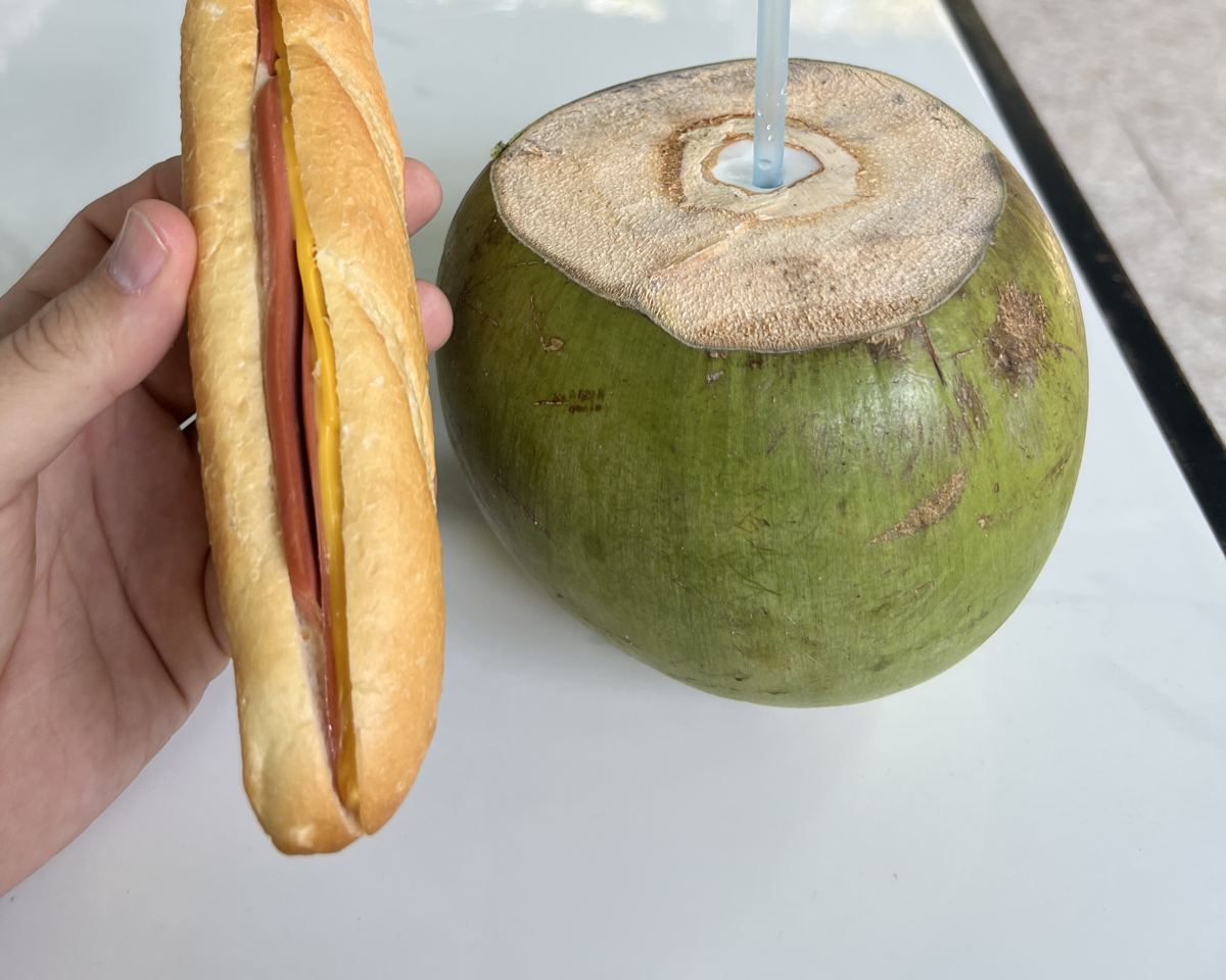 A fresh coconut and a Vietnamese hot dog at the Cu Chi Tunnels