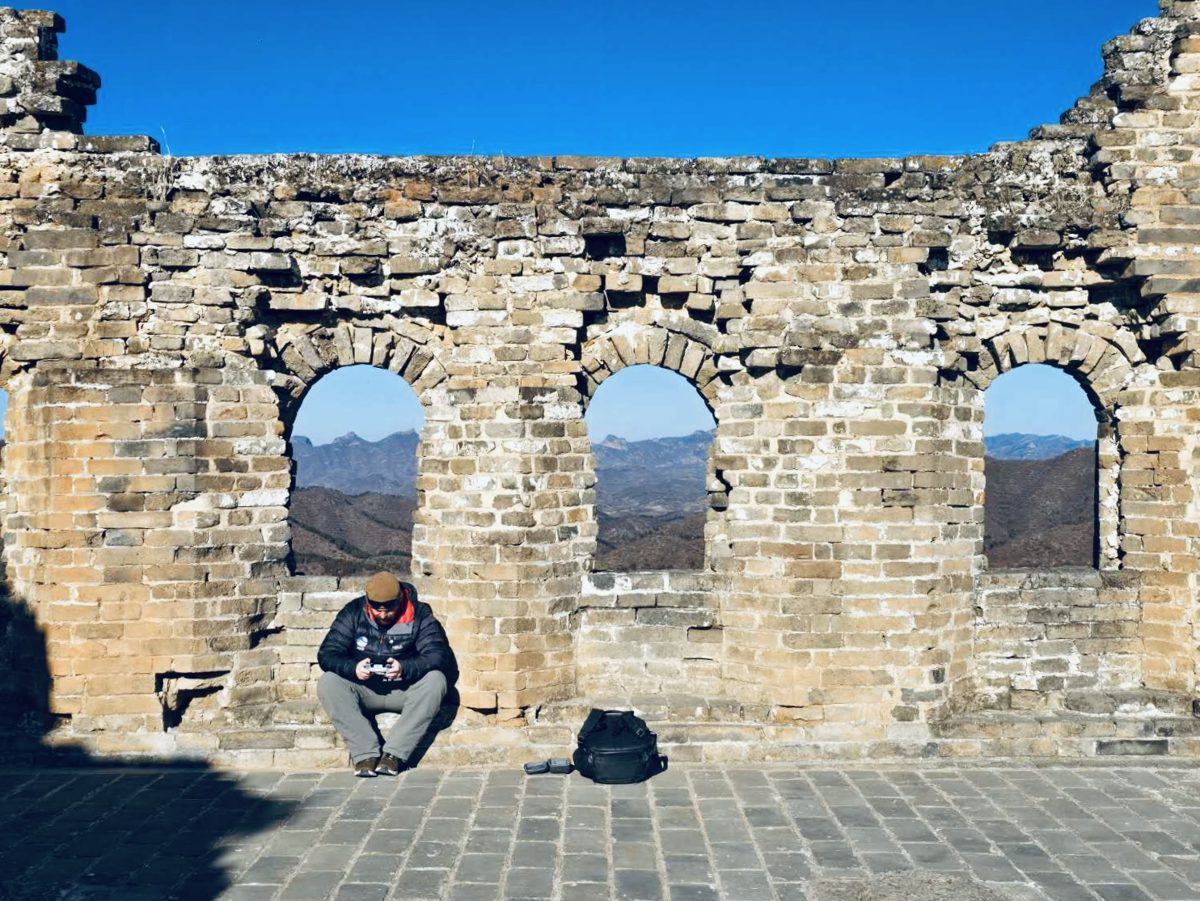 A crumbling watchtower with arched windows at Jinshanling