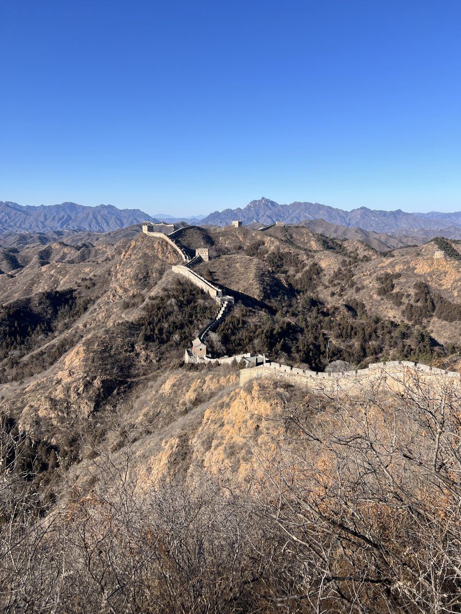 The rugged, unrestored Great Wall at Jinshanling winding over brown mountains