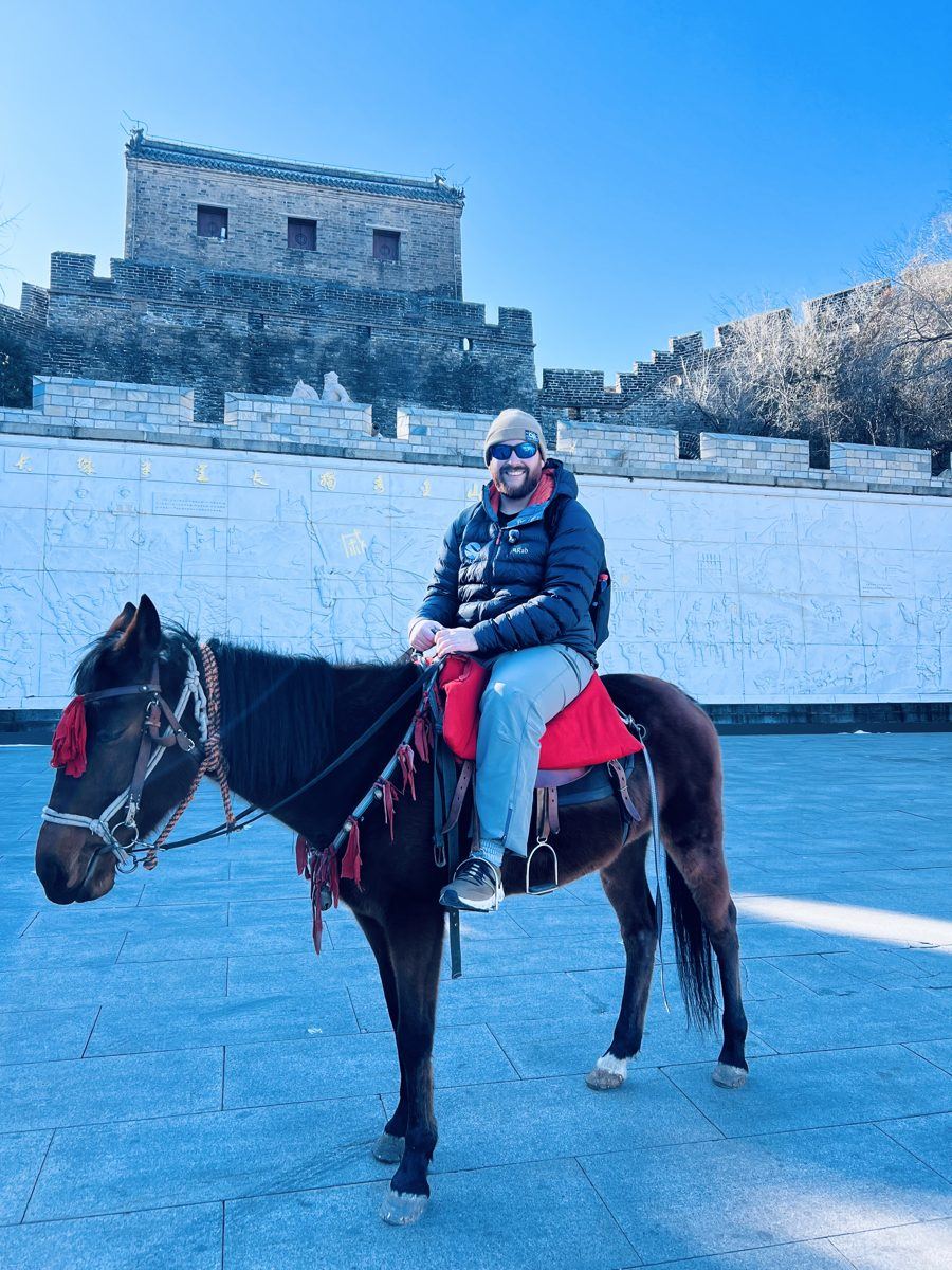 John riding a local farmer's horse at Jinshanling