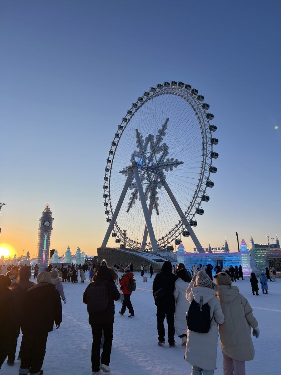 The snowflake Ferris wheel at Harbin Ice and Snow World at sunset